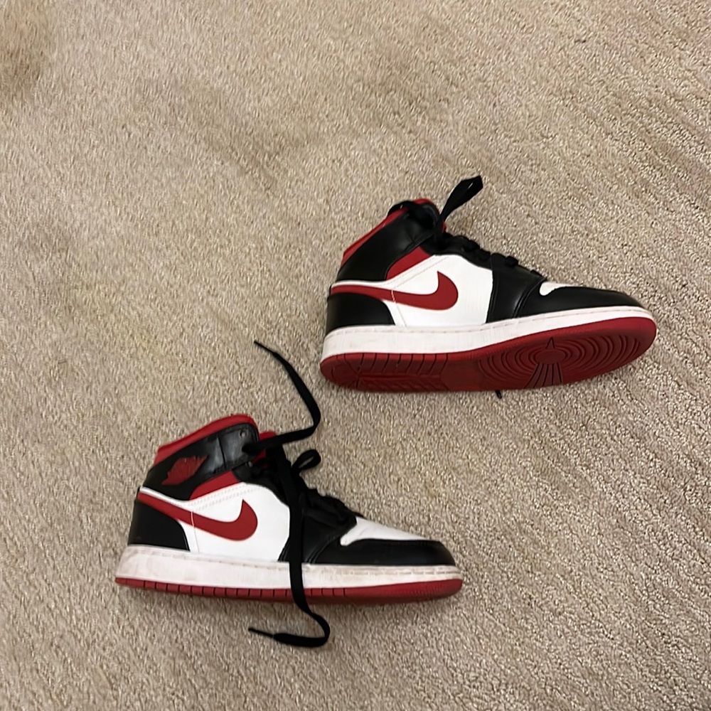 Red and black jordan’s mids